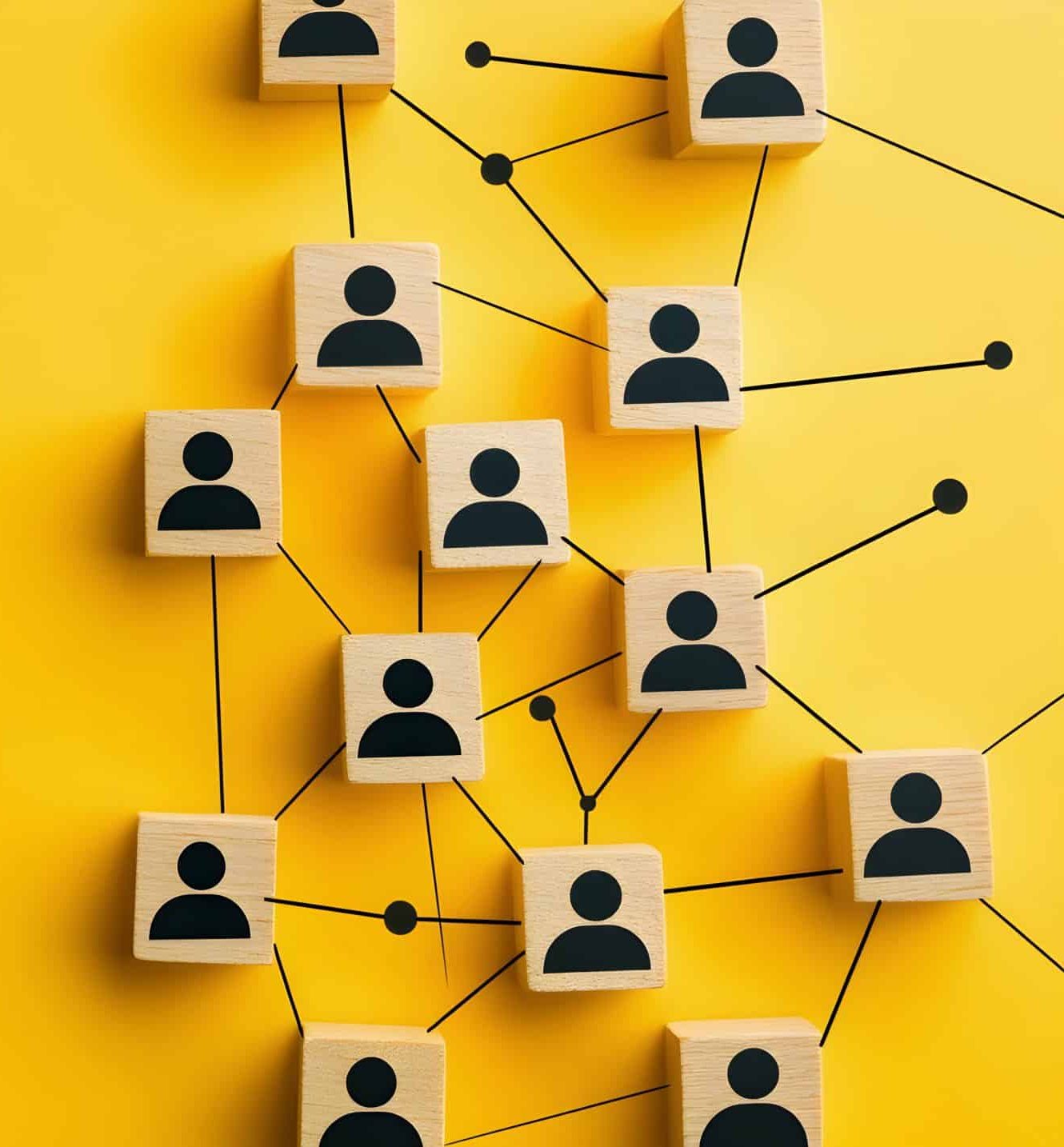 Minimalist yellow background with black lines connecting people icons on wooden blocks, representing social network connections and the concept of human emotions in business Generative AI